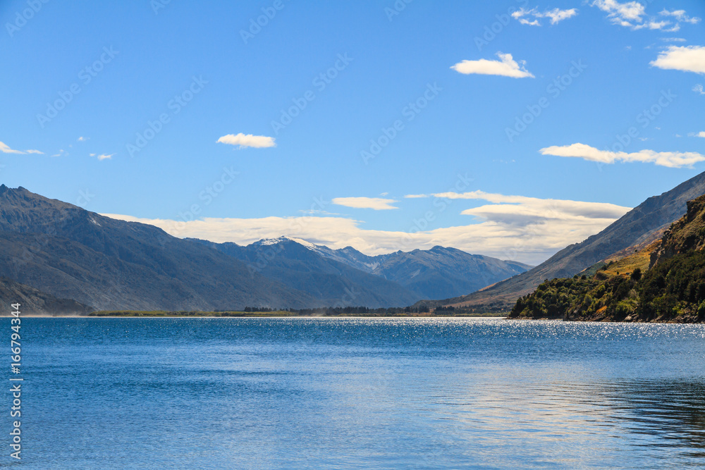 Lake landscape with glittering surface of water
