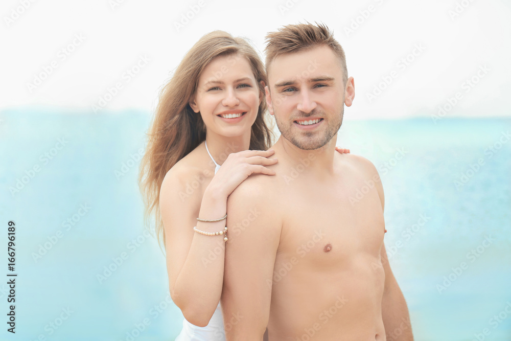 Fototapeta premium Young loving couple on seashore