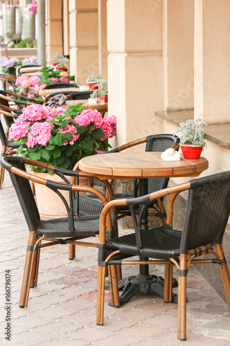 Chairs and tables in cafe © Africa Studio