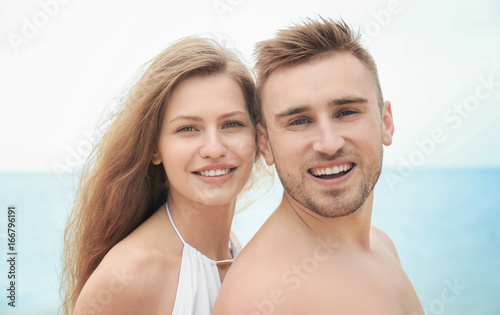 Young loving couple on seashore