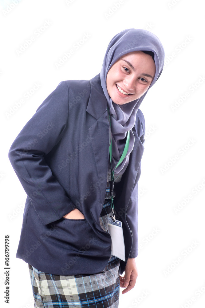 A pretty muslim woman wearing hijab, suit and wearing a blank ID tag or name card on a lanyard isolated on white background A pretty muslim woman wearing hijab, suit and wearing a blank ID tag or name card on a lanyard isolated on white background