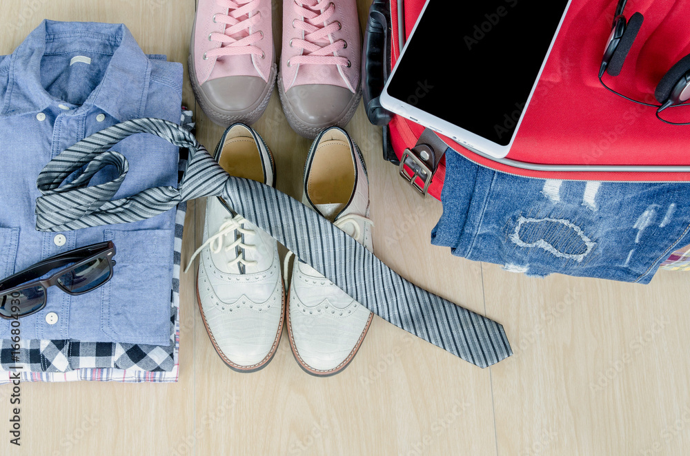 Obraz premium travel accessories and costume on wood floor, Top view