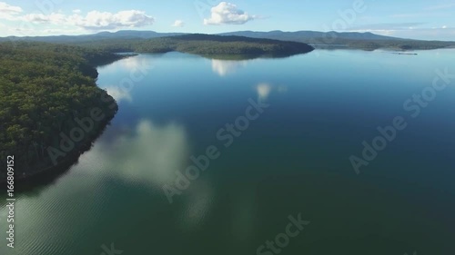 Slow descend over Wallagaraugh river facing the Croajingolong National Park, Australia photo