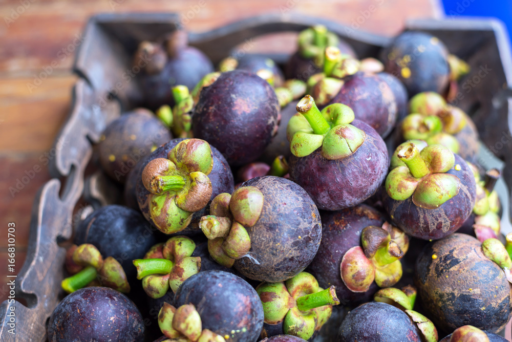 Fototapeta premium fresh mangosteen of Thailand, Thai fruit on wood plate