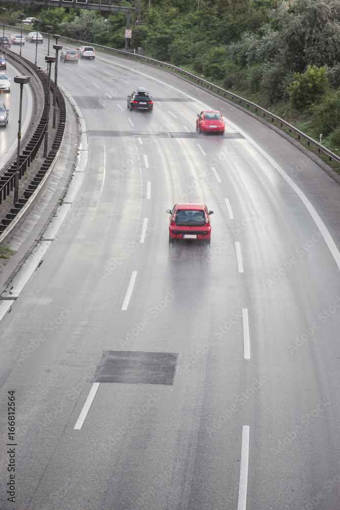 Autobahn cars high speed traffic at rush hour in Berlin Autobahn cars high speed traffic at rush hour in Berlin