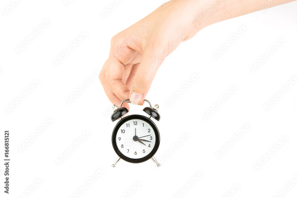Hand Holding Black Alarm Clock On White Background Hand Holding Black Alarm Clock On White Background