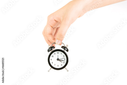 Hand Holding Black Alarm Clock On White Background