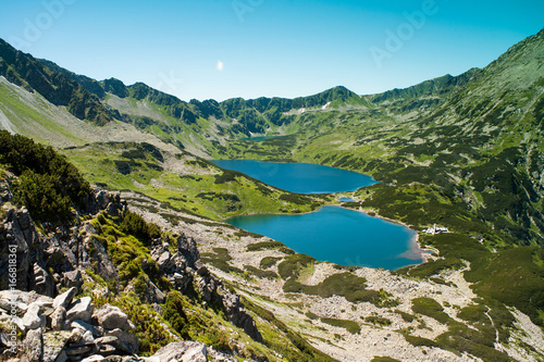 Fototapeta Naklejka Na Ścianę i Meble -  Tatras mountains, Valley of five ponds. View on mountains and two lakes. Trail to see eye from the mountain hostel in five ponds.  Five breathtaking mountain lakes in the High Tatras.