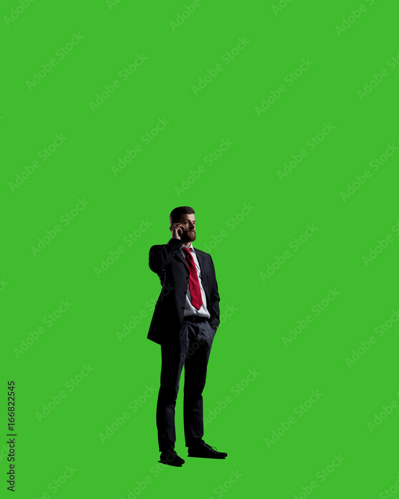 Businessman with smartphone standing over chroma key background. Business, career job concept. Businessman with smartphone standing over chroma key background. Business, career job concept.