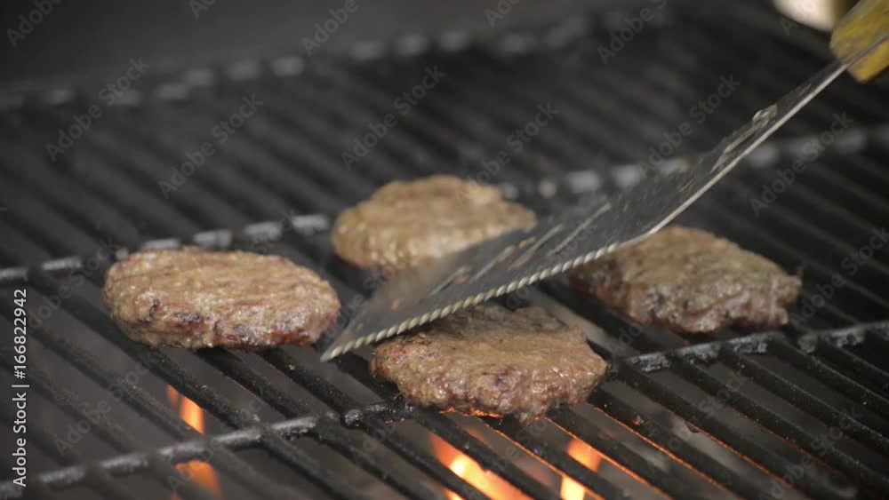 Barbecue burgers on charcoal grill in summer Barbecue burgers on charcoal grill in summer