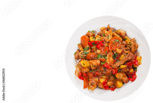 stewed meat with vegetables. top view. isolated on white