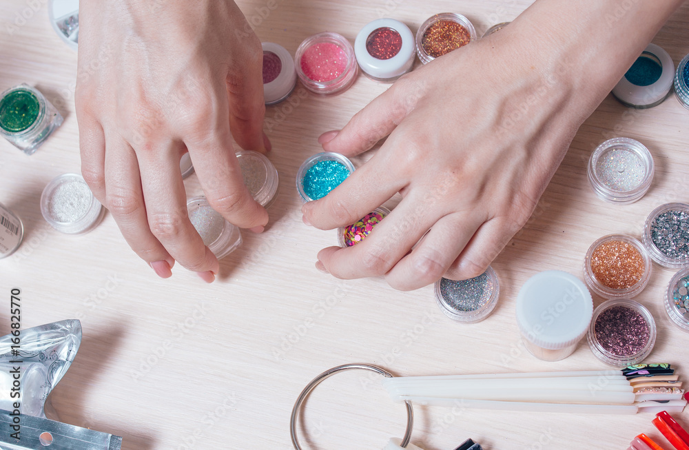manicured woman hands prepeared work with decorations for nails design manicured woman hands prepeared work with decorations for nails design