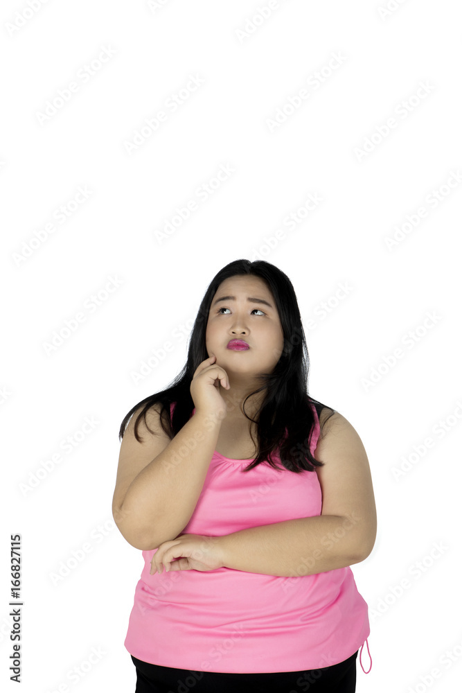 Fat woman thinking something on studio Fat woman thinking something on studio