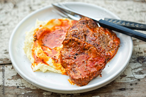 Beef steak in tomato sauce with tomato puree 