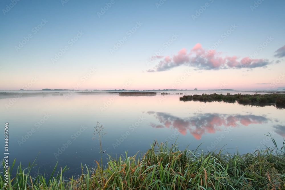 cloud reflection in lake at sunrise