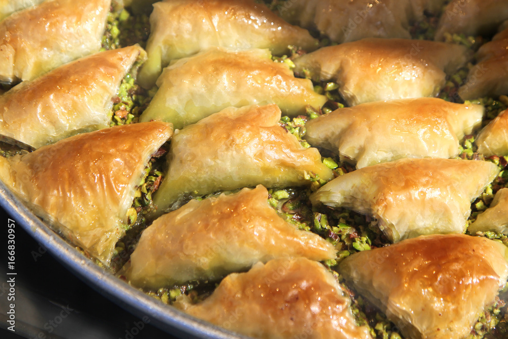 Turkish baklava sobiyet with pistachio nuts. Turkish baklava sobiyet with pistachio nuts.