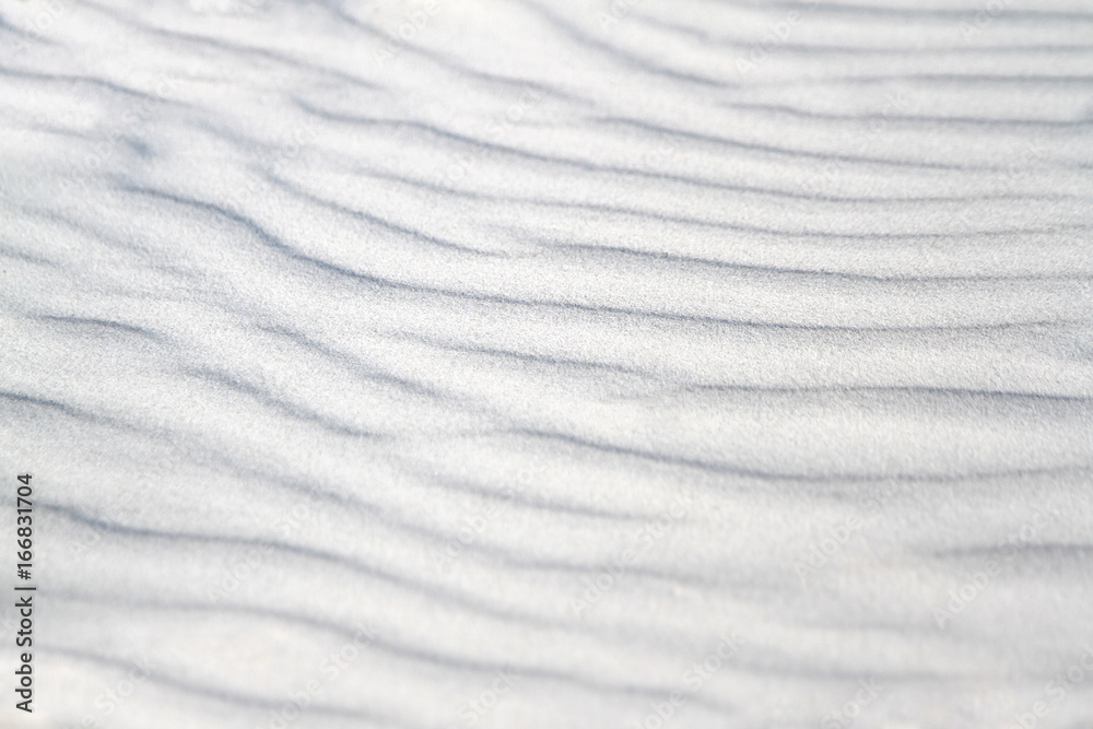 Obraz premium Wavy sand texture for background.