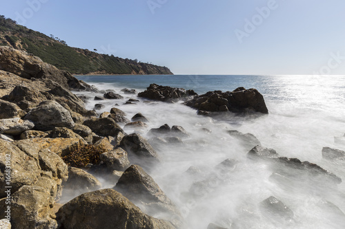 Rancho Palos Verdes rocky coast view with motion blur waves in Los Angeles County, California. 