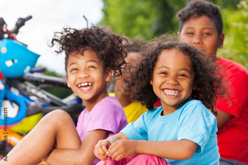 Obraz premium Happy African girl having fun with her friends