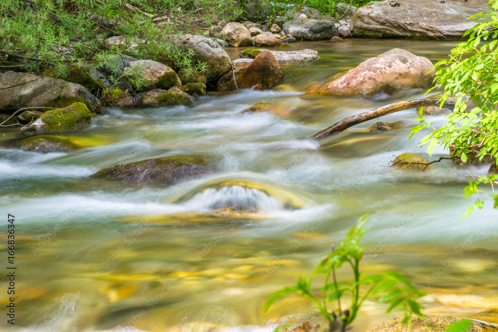 Fototapeta premium Kolasinskaya River flows through the city with a rapid flow. Montenegro, Kolasin.