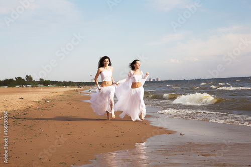 Two white angels on the beach