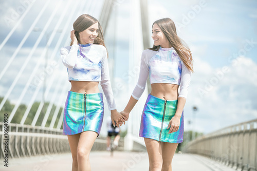 Twins female models posing outdoor. © neonshot