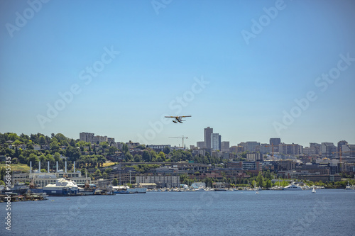 Float plane taking off above the buildings