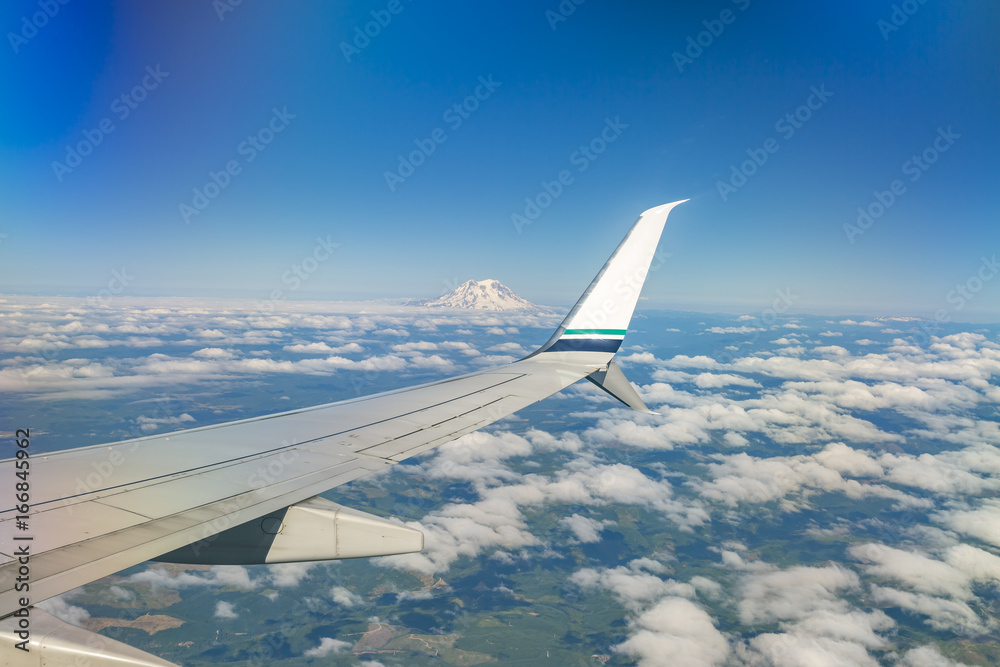 Flying by Mount Rainier in Washington State park views from a commercial plane Flying by Mount Rainier in Washington State park views from a commercial plane