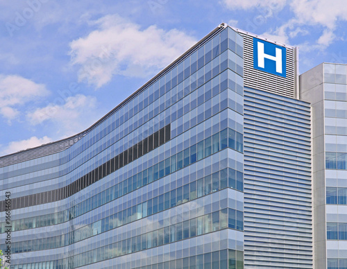 Building with large H sign for hospital photo