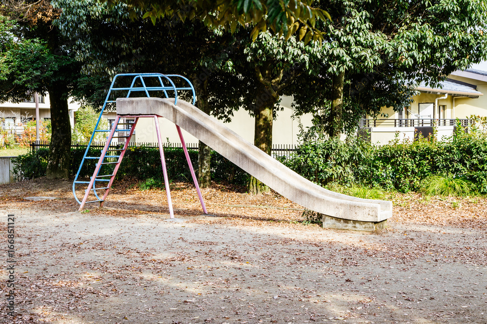 Playground slide with autumn leaves in Japan Playground slide with autumn leaves in Japan