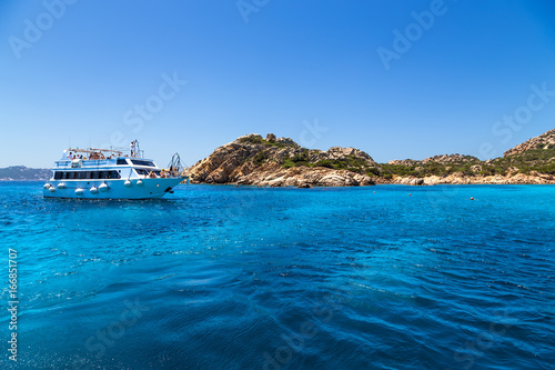 Archipelago of La Maddalena, Italy. Pleasure boat in the picturesque bay of one of the islands