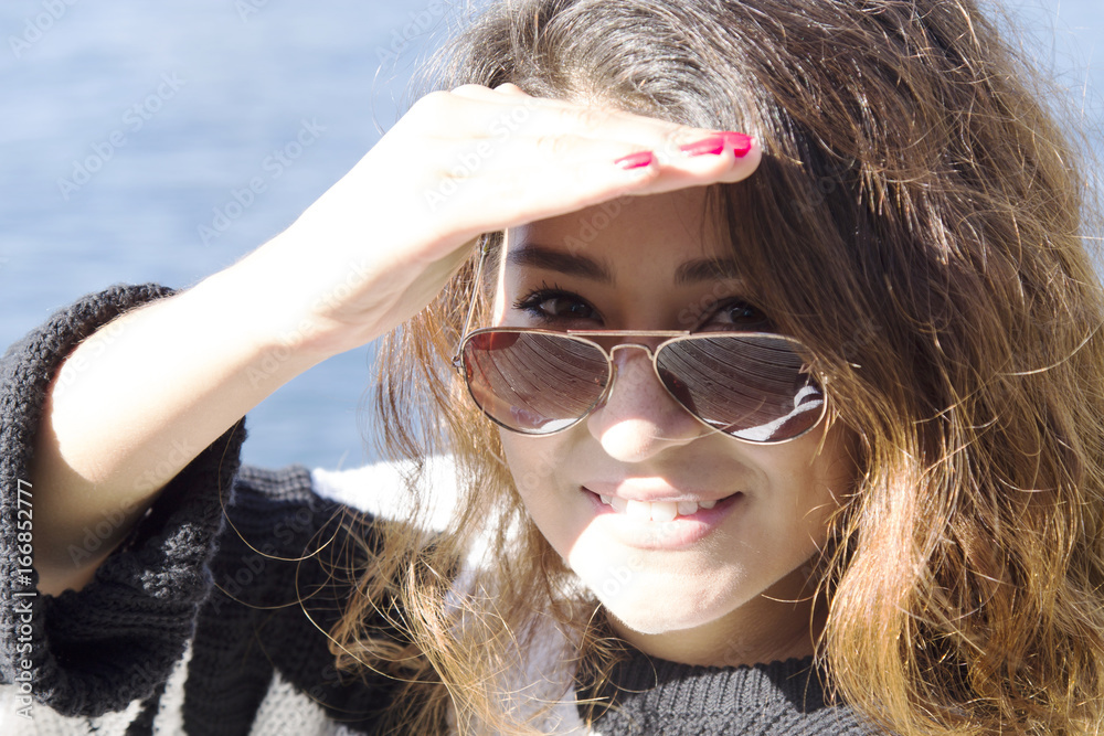 Girl with sunglasses on the sea Girl with sunglasses on the sea