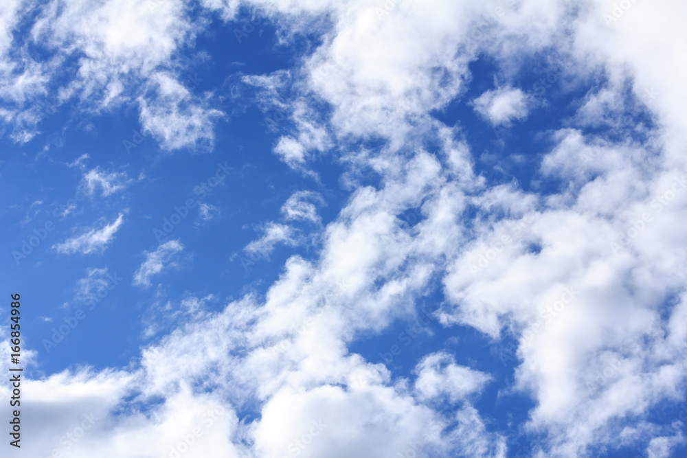 Blue sky background with white clouds and rain clouds on sunny summer or spring day. Blue sky background with white clouds and rain clouds on sunny summer or spring day.