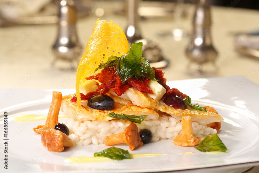 Fine dining - risotto with fish, grapes and chanterelle Fine dining - risotto with fish, grapes and chanterelle