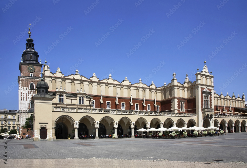 Naklejka premium Cloth Hall (Sukiennice) and Townhouse tower on Main square in Krakow. Poland