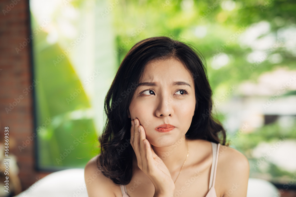 Asian young woman with teeth hurt at home. Asian young woman with teeth hurt at home.