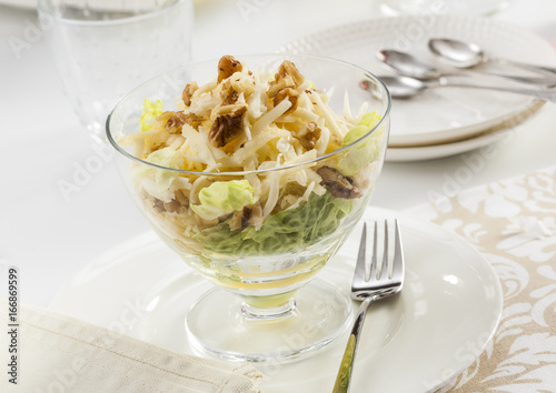 Healthy salad with apple, cheese and walnuts.