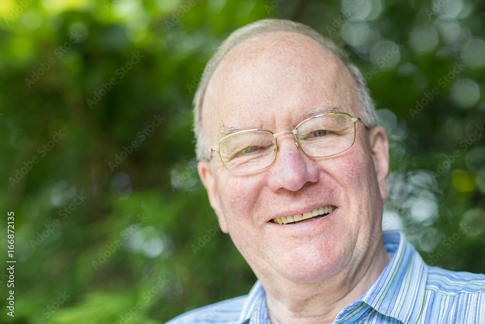 Portrait Of Senior Man Relaxing In Garden Portrait Of Senior Man Relaxing In Garden