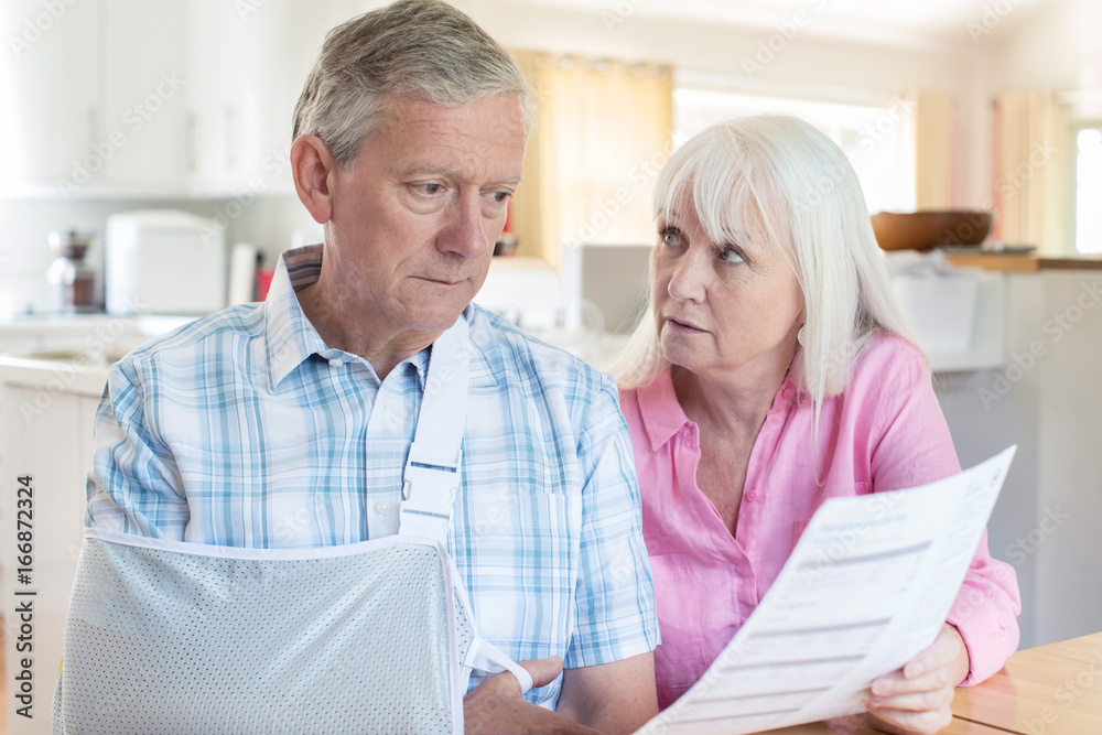 Couple Reading Letter About Husband's Injury Couple Reading Letter About Husband's Injury