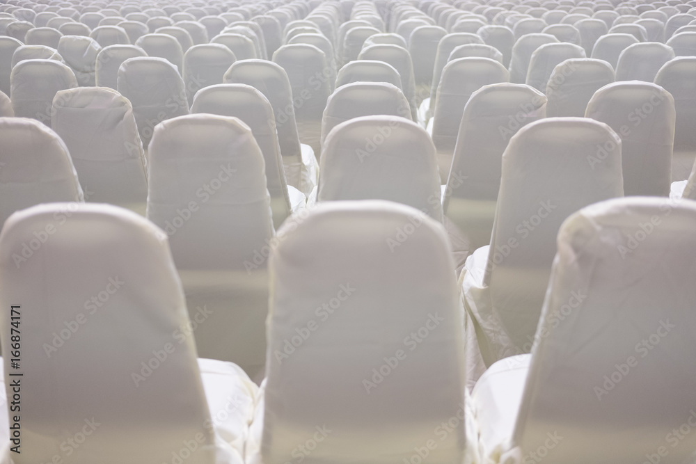 Fototapeta premium modern conference hall interior with white chairs. seminar room with empty seat. business event