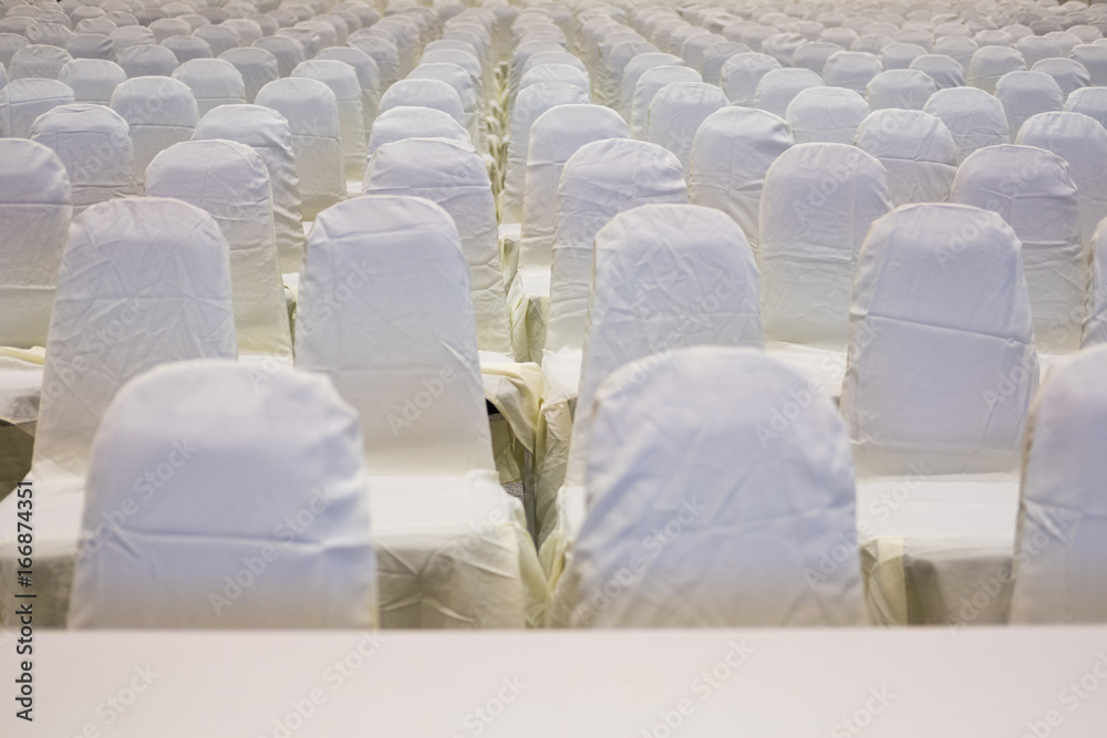 Fototapeta premium modern conference hall interior with white chairs. seminar room with empty seat. business event