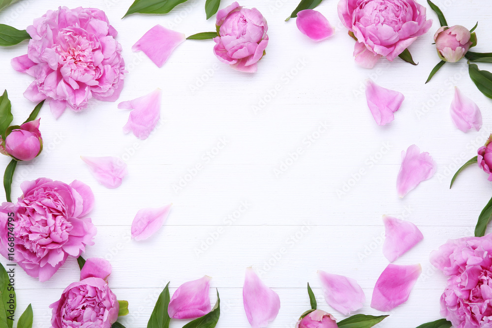 Bouquet of peony flowers on white wooden table