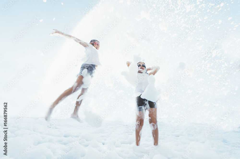Children having fun in foam party. Children having fun in foam party.