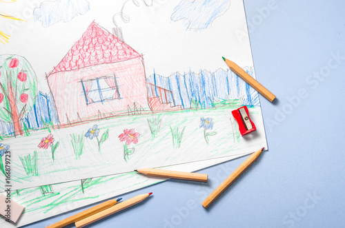 Children's drawing and color pencils top view