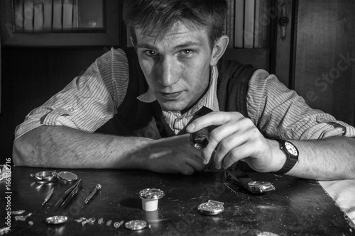 The watchmaker is repairing the mechanical watches in his workshop