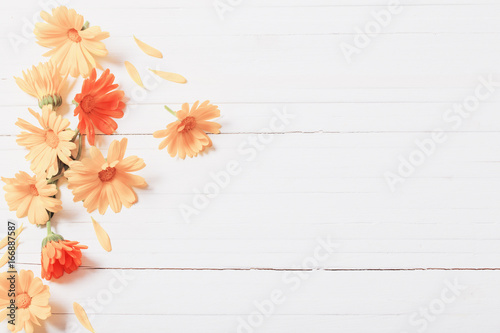 Calendula  Marigold  herbal tea  on white wooden table