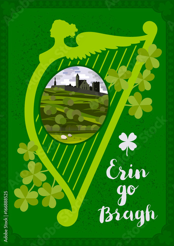 Vector greeting card. Harp, Irish landscape with Cashel castle, clover leaves and lettering quote. photo