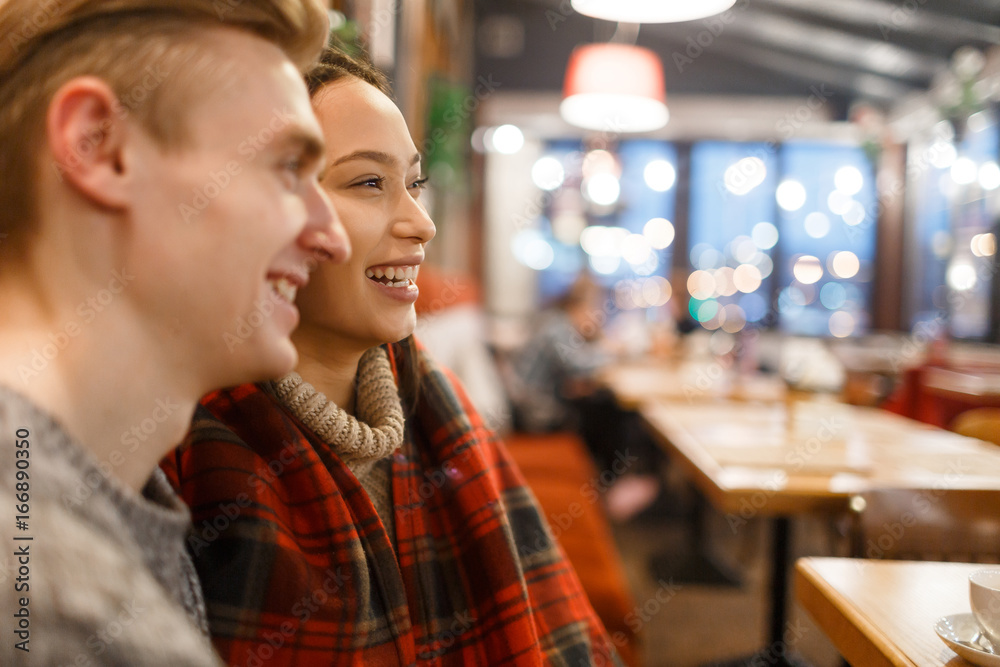 Bonding couple spending time in cafe after walk Bonding couple spending time in cafe after walk