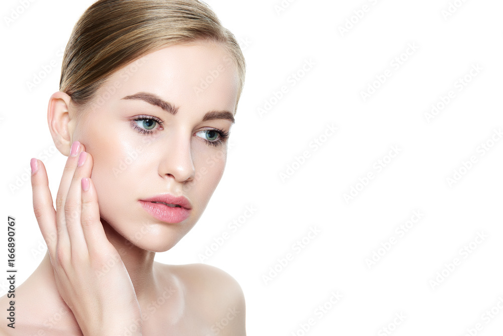Beautiful Young Blond Woman with Perfect Skin touching her face. Facial treatment. Cosmetology, beauty and spa concept. Isolated on white background