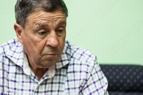 Elderly man lost in thought 